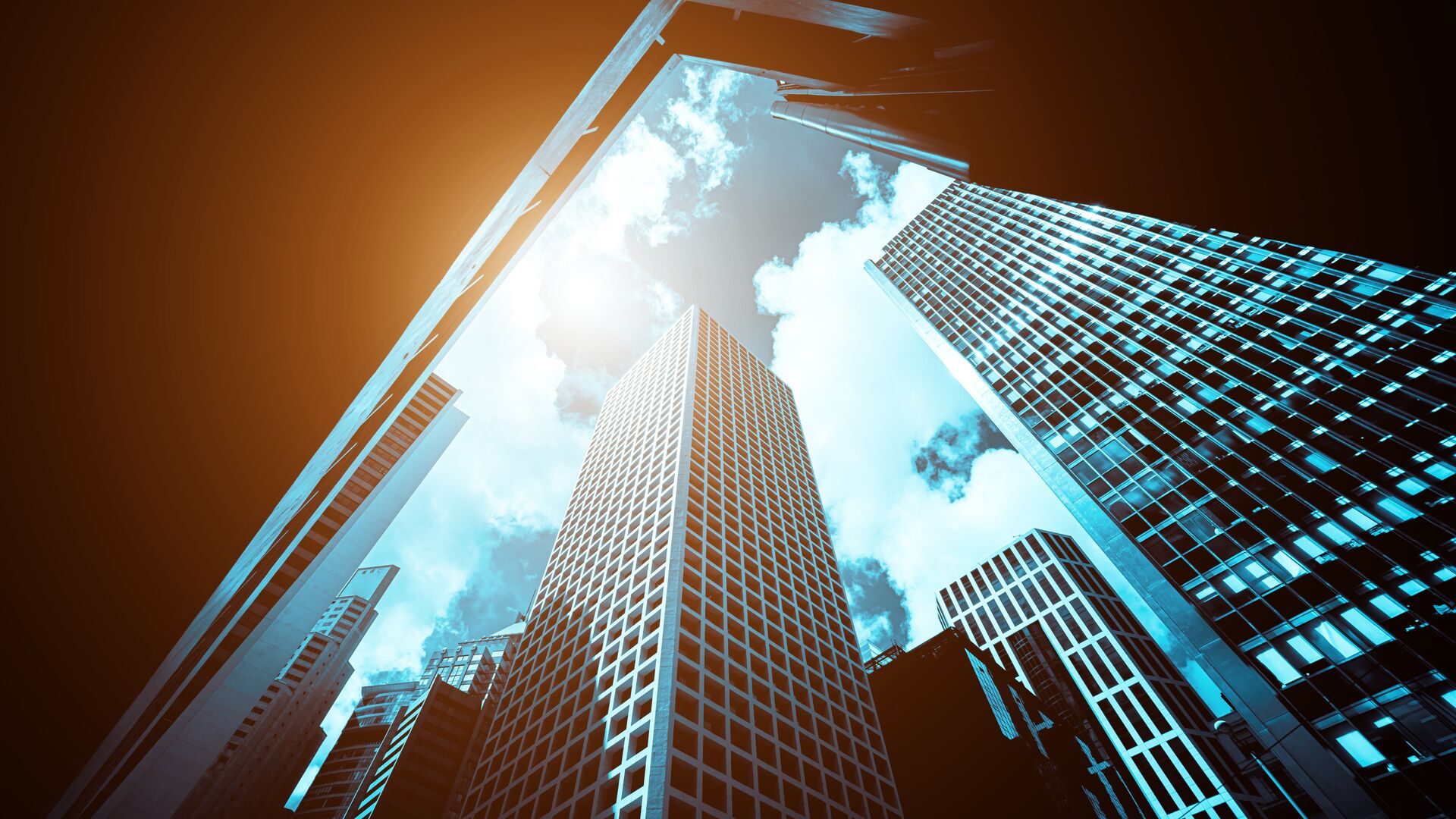 Concept for raising capital, looking above from street level upon a metropolis of large sky scrapers cast in sun. Jeb Altonaga, Founder of Clearglass Capital Partners & Cowen's own Amy Cheung discuss the soft skills involved in raising capital.