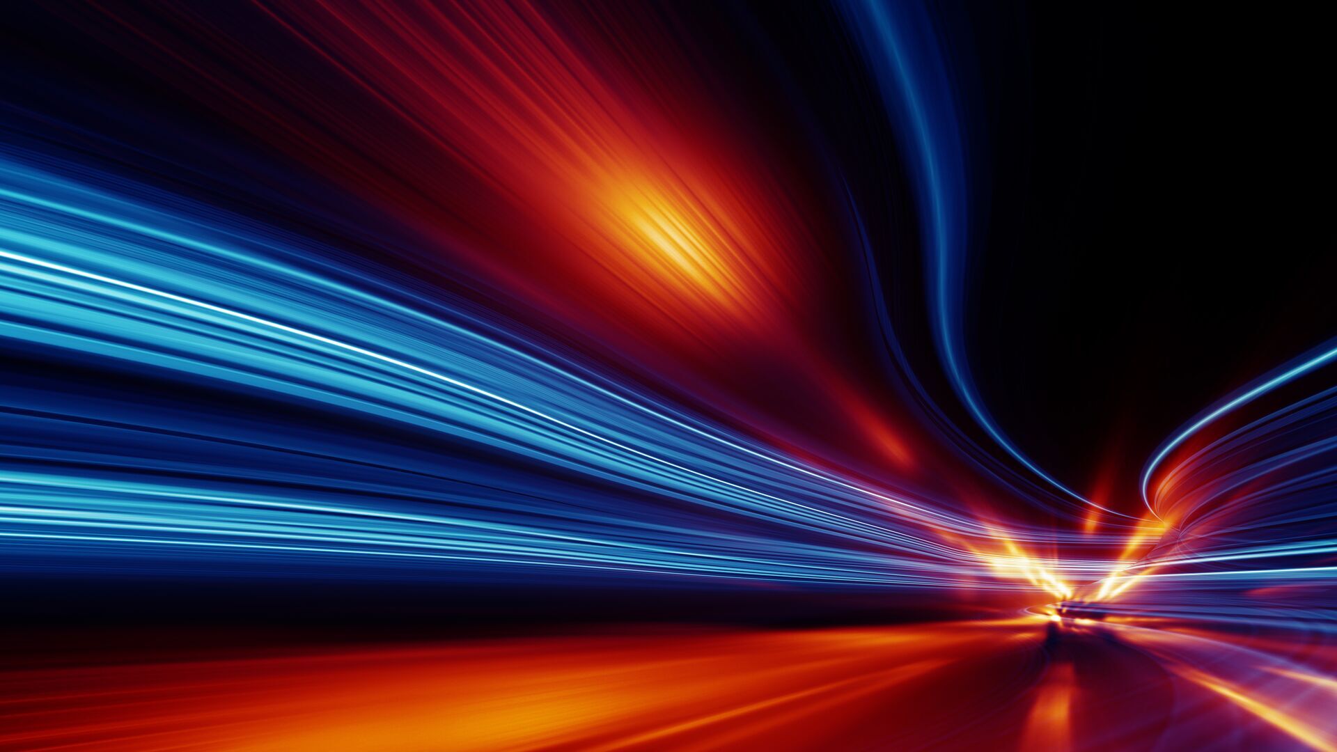 Abstract photograph of long-exposure light streaks coming off of a fast-moving car.