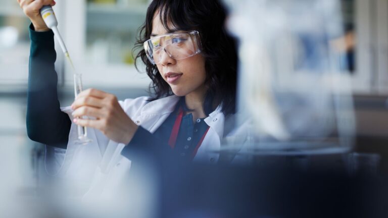 Medical researcher conducting pharmaceutical research in a lab. Representing innovation in biotech and oncology, specifically in anti body drug conjugates (ADSs).